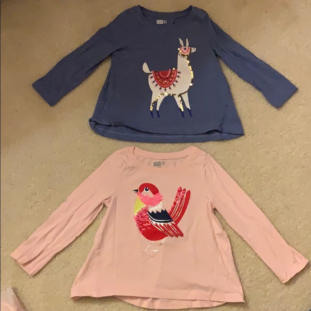 Twin girls similar sequin shirts